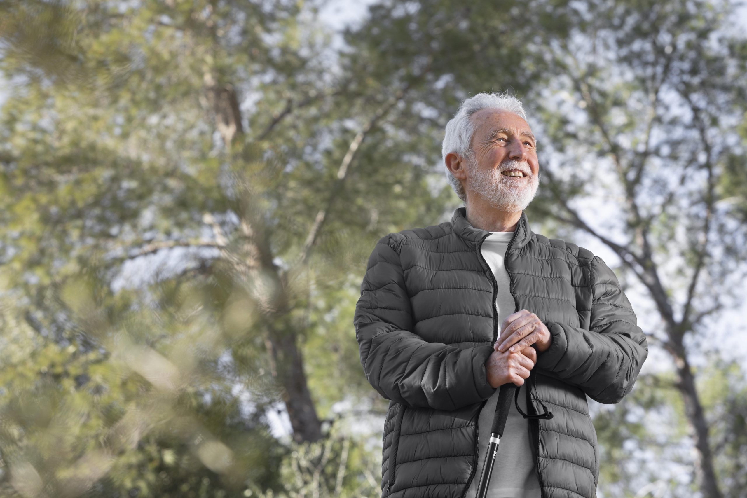 portrait-senior-man-hiking-mountain